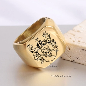 Macro view of 18mm gold stainless steel ring featuring detailed lion crest engraving