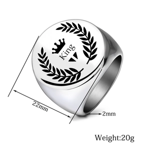 Macro detail of silver stainless steel signet ring with King and crown engraving