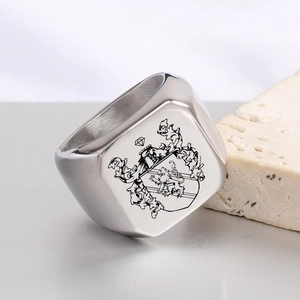Macro shot of stainless steel signet ring with vintage griffin crest and lion engraving