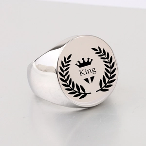 Polished silver stainless steel signet ring with King and crown laurel leaf design
