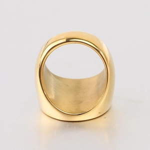 Close-up of wide 22mm gold stainless steel cigar ring with brushed metal texture