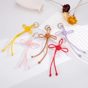 Handmade woven leather knot bag charms with silver metal rings in five assorted colors