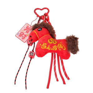 Red plush horse keychain with lucky charm dice and leopard print heart clip on white background