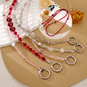 Beaded heart and star crossbody phone chain with polished metal spring rings