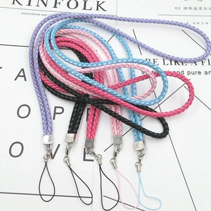 Flat lay of colorful braided PU leather lanyards with silver metal hooks for ID badges