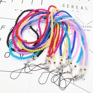 Close-up of colorful beaded crystal lanyards with lobster clasps for mobile phones