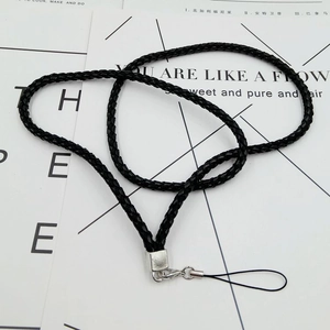 Detail of black braided neck lanyard with silver metal lobster clasp and square end cap