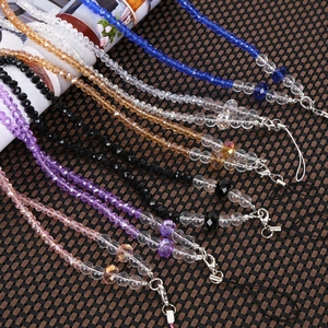 Detail of colorful faceted crystal bead phone lanyards with metal lobster clasps