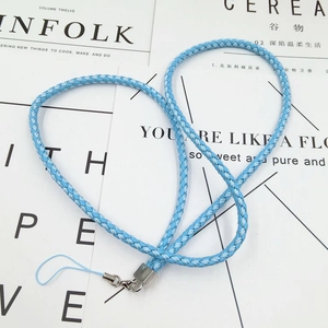 Detail of light blue woven lanyard featuring a metal lobster clasp on Kinfolk magazines