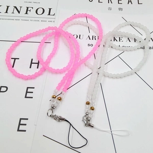 Detail of pink and white crystal beaded phone lanyards with lobster claws and charms