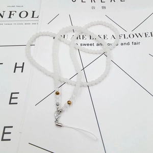 Detail of beaded crystal phone lanyard with frosted white beads and silver lobster clasp