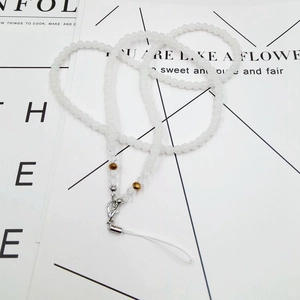 Detail view of beaded lanyard featuring cream beads and a secure lobster clasp
