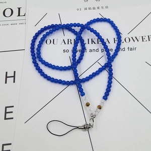 Detailed macro view of the blue crystal beaded phone lanyard with a durable metal lobster clasp
