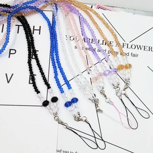 Detail view of crystal beaded phone lanyards in multiple colors with metal lobster clasps