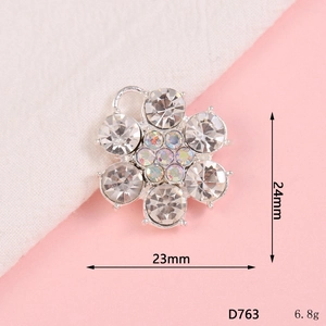 Detail of six-petal flower pendant with white and iridescent rhinestones for DIY jewelry