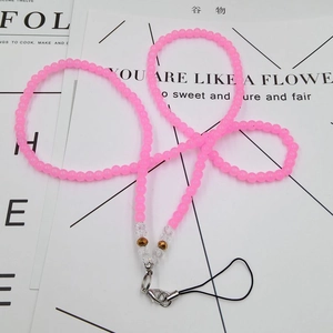 Close-up of pink frosted beaded phone lanyard with clear crystal and lobster clasp