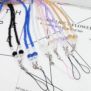 Close-up of crystal beaded phone straps in six colors with silver lobster clasps