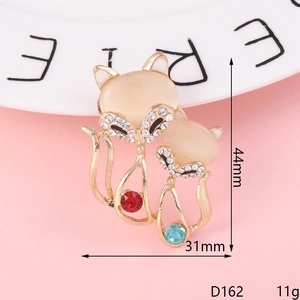 Macro view of fox brooch with cat eye stones and rhinestones showing 44mm height detail
