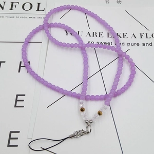 Detail of light purple beaded phone lanyard with clear crystal accents and silver clasp