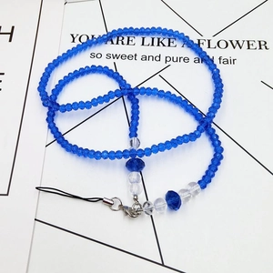 Detail showing royal blue faceted crystal beads with silver lobster clasp on phone lanyard