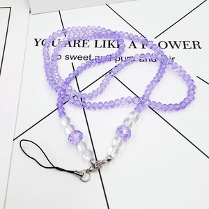 Detail view of purple crystal beaded phone lanyard with faceted beads and silver lobster clasp