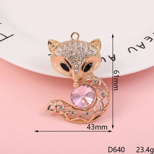 Detail view of 61mm crown fox pendant with pink crystal and white rhinestones