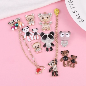 Macro shot of assorted rhinestone bear and panda charms for DIY phone cases and jewelry