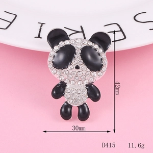 Detail of a sitting panda brooch with black enamel and white crystal rhinestones
