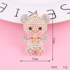 Detailed view of a sparkling 31mm x 44mm bear pendant with pearls and rhinestones