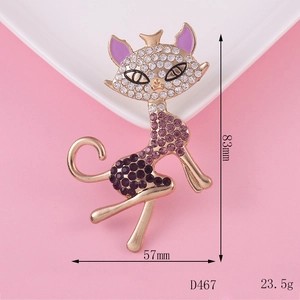 Cat brooch with purple and white rhinestones on gold alloy base showing 83mm by 57mm size