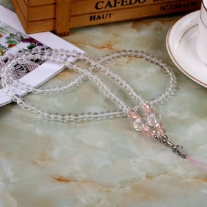 Detailed view of beaded crystal lanyard with pink accent beads and silver lobster clasp