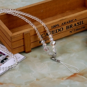 Detailed view of crystal phone lanyard with clear beads and silver lobster clasp