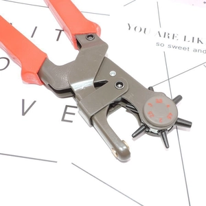 Heavy duty rotary leather hole punch tool with red non-slip handles for belts and watches