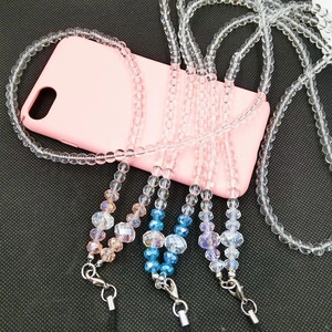 Macro detail of multi-colored crystal beaded phone lanyard with a silver lobster clasp