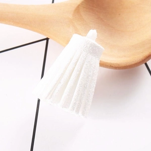 Close-up of a 3cm white suede tassel pendant with a top ring for DIY jewelry making