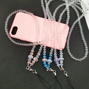 Detailed view of colorful pearl and crystal beaded phone lanyards with metal lobster clasps