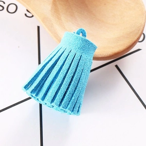 Detail shot of a bright electric blue 3cm faux suede tassel pendant for DIY jewelry