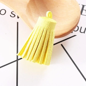 Detailed view of 3cm bright yellow suede tassel pendant with ring for DIY crafts