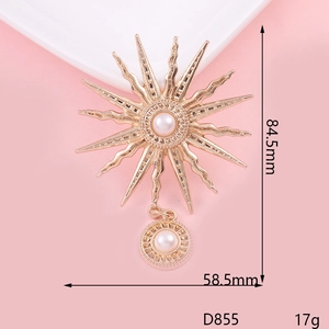 Détails d'une broche fleur de soleil dorée de 84,5x58,5mm avec perles et strass