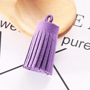 Macro shot of 3cm purple faux suede tassel pendant for DIY jewelry and keychains