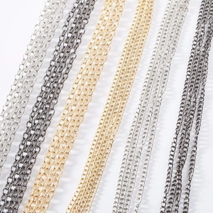 Macro shot of assorted metal cable chains in gold, rose gold, silver and gunmetal finishes