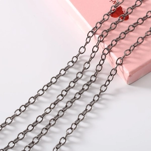 Close-up of four parallel gunmetal gray metal fine chains for DIY jewelry making