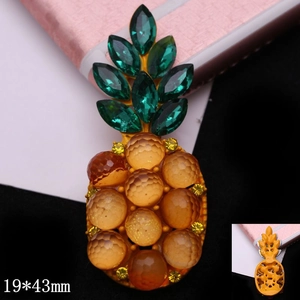 Detailed macro view of pineapple jewelry charm with 19x43mm dimensions and gem texture