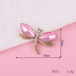 Detailed view of rhinestone dragonfly pendant with pink crystal wings and size specs