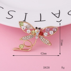 Exquisite gold alloy dragonfly brooch with multi-colored rhinestones measuring 42mm by 31mm