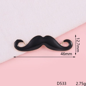 Detailed macro view of black enamel mustache accessory with 46mm x 12.7mm dimensions