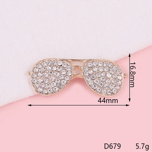 Detailed view of pilot sunglasses brooch with dimensions 16.8mm by 44mm and clear rhinestones