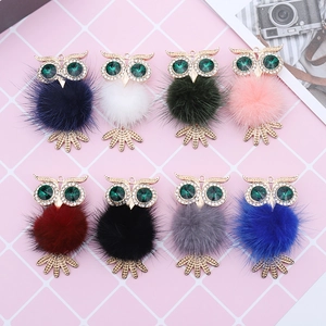 Set of eight colorful rhinestone owl car clips with plush pompoms and gold alloy details