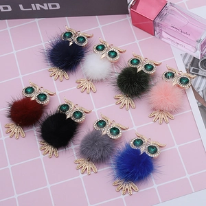 Sparkling rhinestone owl pendant with soft faux fur pompon in eight vibrant colors