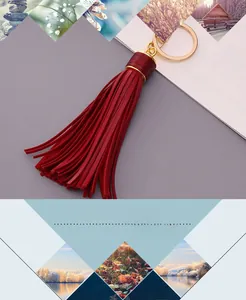 Detail of red leather tassel keychain with golden metal ring and stylish DIY hardware